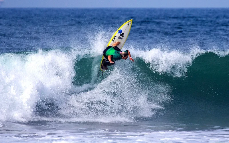 Sage Erickson surfing waves at Huntington Beach